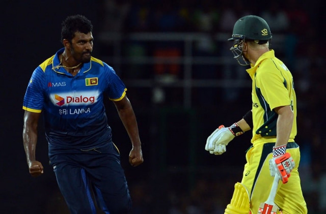sri lanka 039 s thisara perera l celebrates after he dismissed australia 039 s david warner r during the second one day international odi cricket match between sri lanka and australia at the r premadasa international cricket stadium in colombo on august 24 2016 photo afp