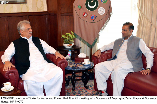 minister of state of water and power abid sher ali meeting governor kp engr iqbal zafar jhag at governor house photo inp