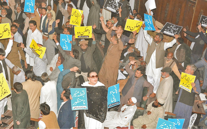 members carrying placards voice for the provision of basic facilities during the city council meeting on thursday photo jalal qureshi express