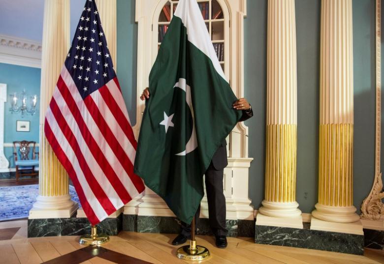 a state department contractor adjust a pakistan national flag photo reuters