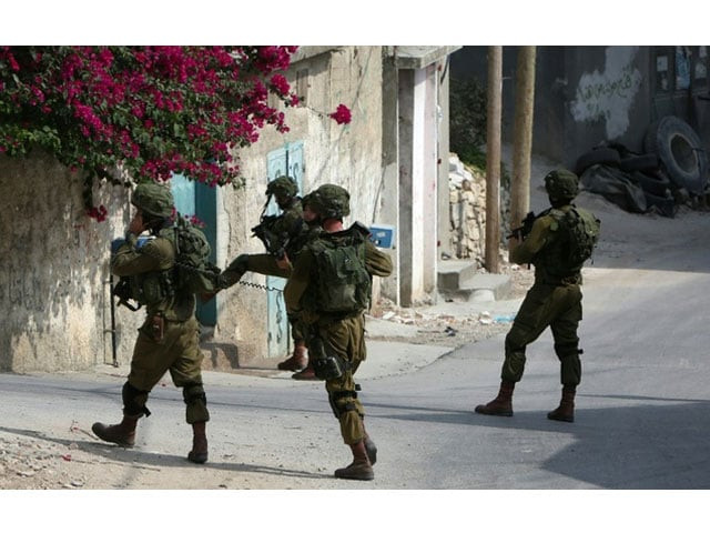israeli troops shot dead suspected palestinian assailant in the west bank village of silwad photo afp israeli troops shot dead suspected palestinian assailant in the west bank village of silwad photo afp
