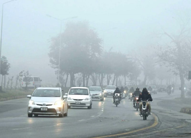 dense fog envelops a road in the bharakahu area of the federal capital photo app dense fog envelops a road in the bharakahu area of the federal capital photo app