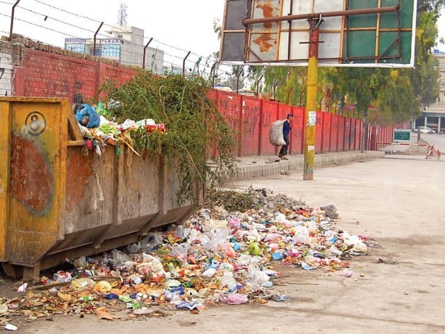 for the residents of karachi it is more than a garbage dump it is a forever looming health hazard photo file