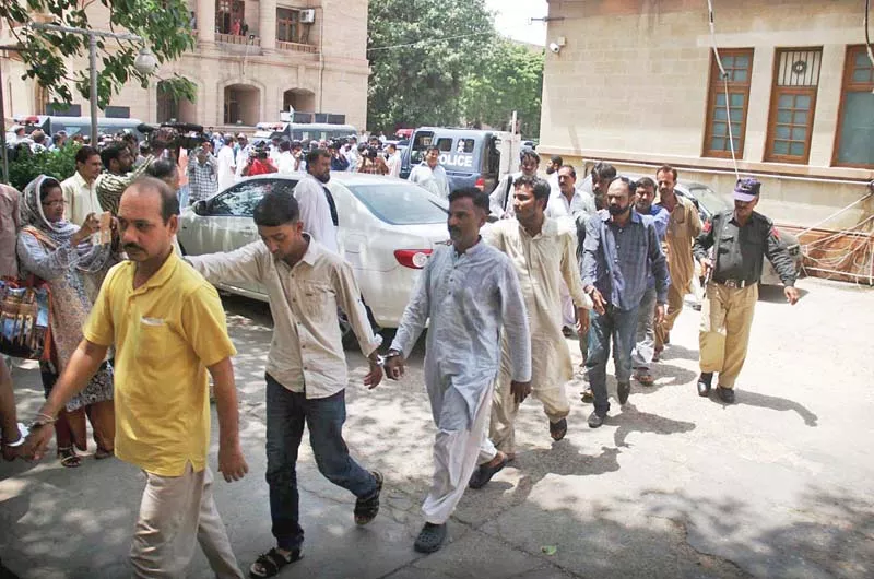 the mqm workers held for allegedly taking part in rioting on august 22 are being transported from the jail photo online the mqm workers held for allegedly taking part in rioting on august 22 are being transported from the jail photo online
