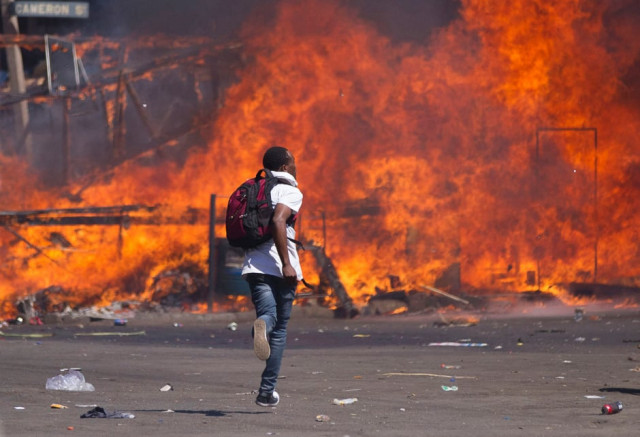 zimbabwe 039 s opposition supporters set up a burning barricade as they clash with police during a protest for electoral reforms photo afp