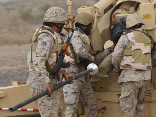 saudi soldiers load an artillery piece at a position close to the saudi yemeni border photo afp