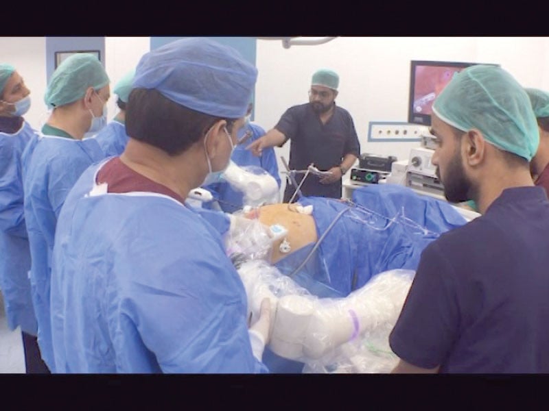 a team of doctors and technicians perform a robot assisted surgery at jpmc karachi photo express