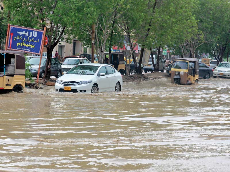 a view of the inundated university road in gulistan e jauhar photo athar khan express