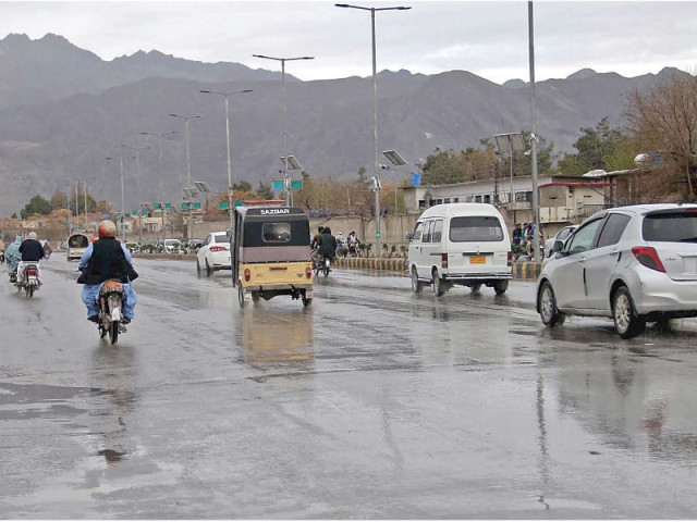 commuters make their way on a road amid rain showers in quetta on thursday photo ppi commuters make their way on a road amid rain showers in quetta on thursday photo ppi