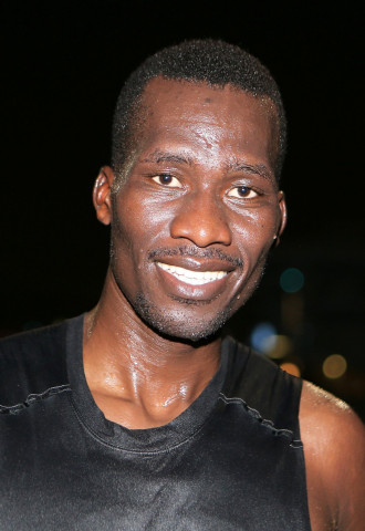 kenyan runner michael douglas ongeri poses for a photo on august 16 2016 in the qatari capital doha six days a week after completing his thirteen hour night shift as a security guard photo afp kenyan runner michael douglas ongeri poses for a photo on august 16 2016 in the qatari capital doha six days a week after completing his thirteen hour night shift as a security guard photo afp