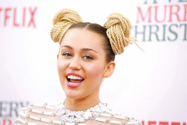 singer miley cyrus took the stage as the mc of last year s award show in los angeles photo file singer miley cyrus took the stage as the mc of last year s award show in los angeles photo file
