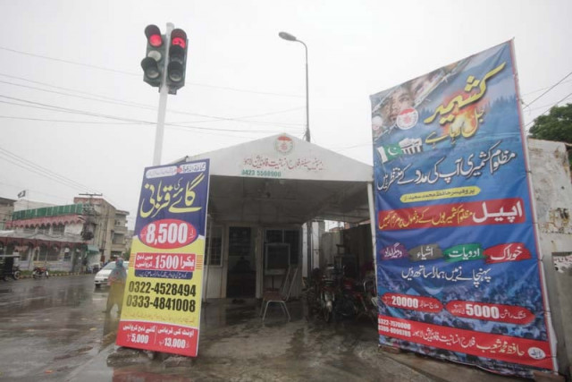 publicity material seeking donations for various jud activities can be seen at various intersections and major city roads photo abid nawaz publicity material seeking donations for various jud activities can be seen at various intersections and major city roads photo abid nawaz