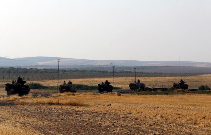 turkish armoured personnel carriers drive towards the border in karkamis on the turkish syrian border in the southeastern gaziantep province turkey august 27 2016 photo reuters