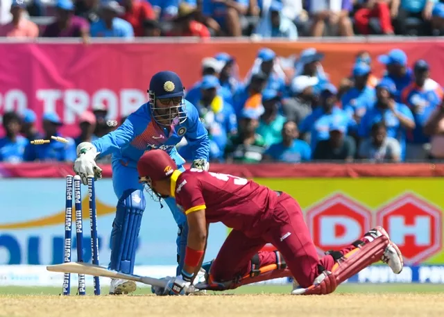 lendl simmons r stumped by ms dhoni l at central broward stadium on august 28 2016 photo afp lendl simmons r stumped by ms dhoni l at central broward stadium on august 28 2016 photo afp