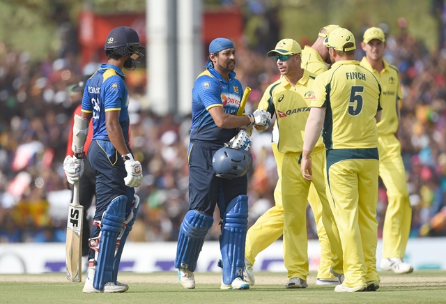 tillakaratne dilshan 2l is congratulated by david warner c and teammates as he leaves the ground after being dismissed in dambulla on august 28 2016 photo afp