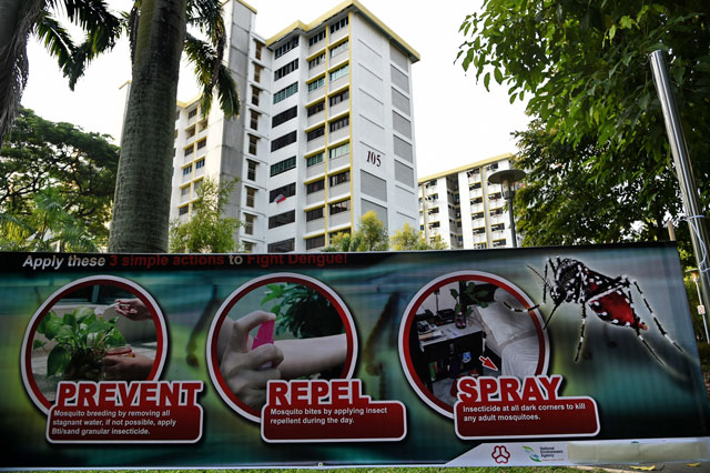 a public service announcement banner against the spread of aedes mosquitoes a carrier for the zika virus is seen at a residential block at aljunied crescent neighbourhood in singapore on august 29 2016 photo afp