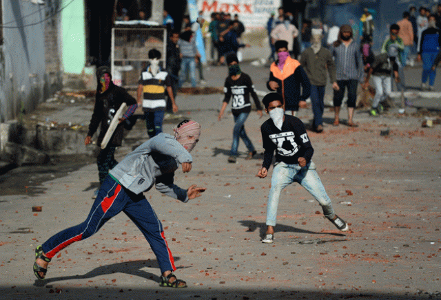 kashmiri protesters throw stones at indian security forces in srinagar on monday photo afp kashmiri protesters throw stones at indian security forces in srinagar on monday photo afp