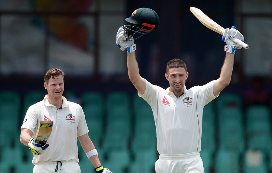 shaun marsh r raises his bat after reaching his century on august 15 2016 photo afp