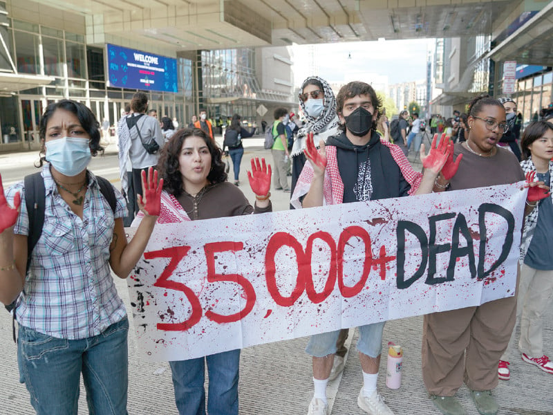 people protest in support of palestinians in gaza ahead of democratic vice presidential nominee minnesota governor tim walz s address at the human rights campaign national fundraising dinner at the washington convention center photo reuters