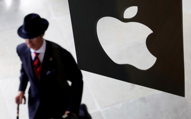 a customer enters the new apple store which is the world 039 s largest on its opening day at covent garden in london photo reuters