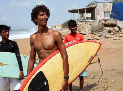 surfers on karachi s coast chase waves and dreams surfers on karachi s coast chase waves and dreams