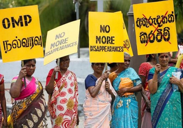 a group of women hold up placards at a silent protest to commemorate the international day of the victims of enforced disappearances in colombo sri lanka august 30 2016 photo reuters