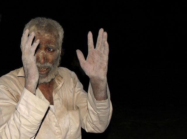 a man reacts after he was rescued from under the rubble of a house destroyed by a saudi led air strike in the northwestern city of saada yemen august 30 2016 photo reuters