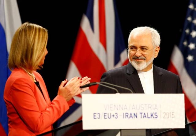 high representative of the european union for foreign affairs and security policy federica mogherini l applauds iranian foreign minister mohammad javad zarif photo reuters