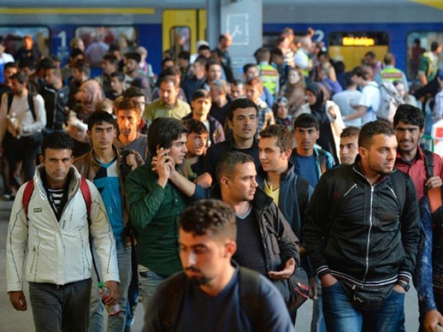 migrants arrive at the railway station in munich southern germany on september 12 2015 photo afp