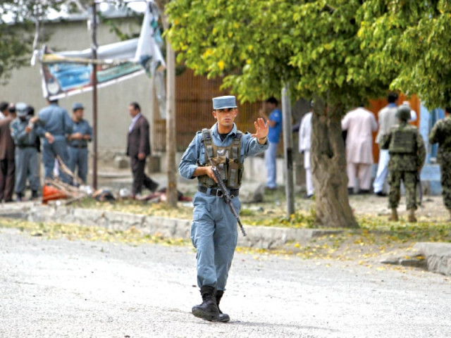 an afghan policeman keeps watch at the site of a suicide bomb attack in kabul photo reuters an afghan policeman keeps watch at the site of a suicide bomb attack in kabul photo reuters