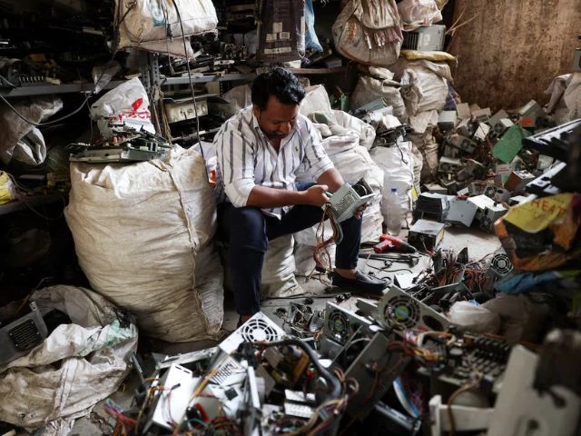 a man recycles electronic waste or e waste from computer power supplies at a scrap yard in ahmedabad india april 9 2025 photo reuters a man recycles electronic waste or e waste from computer power supplies at a scrap yard in ahmedabad india april 9 2025 photo reuters