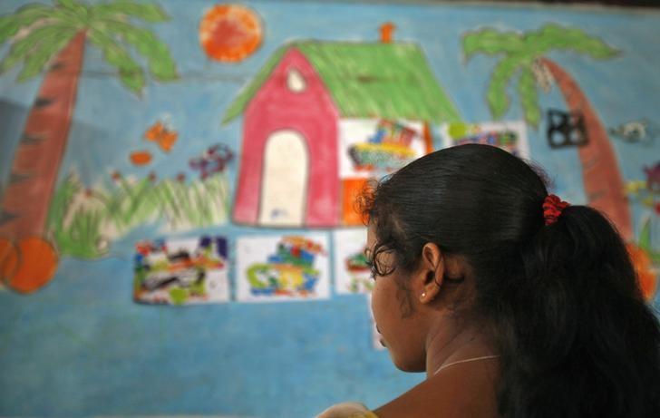 a 16 year old girl stands inside a protection home on the outskirts of new delhi photo reuters