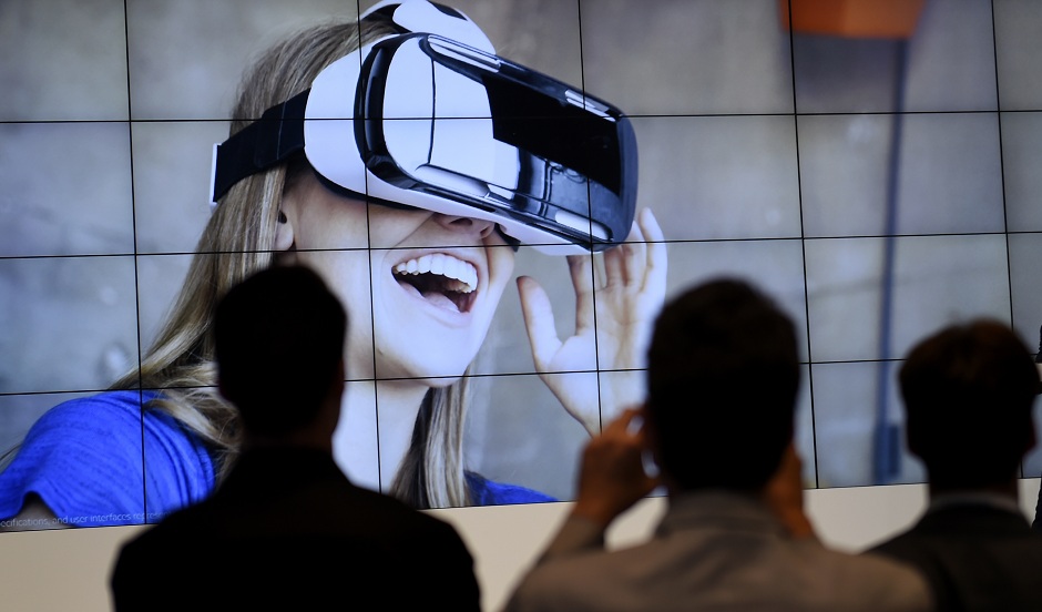 visitors attending a presentation of the virtual reality headset gear vr photo afp