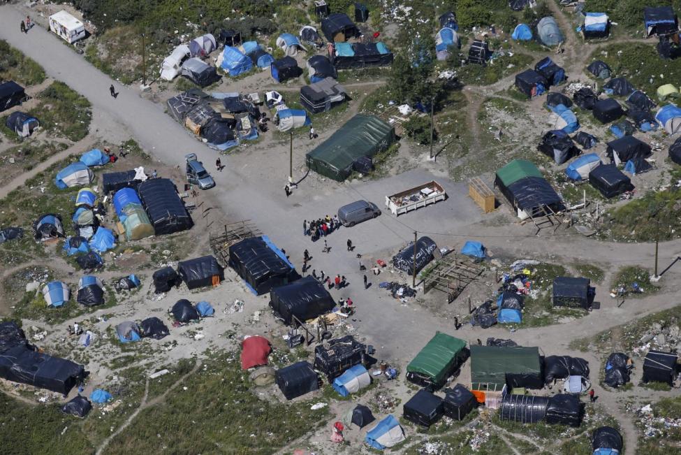 an aerial view shows a field named quot the new jungle quot with tents and makeshift shelters where migrants and asylum seekers stay in calais photo reuters