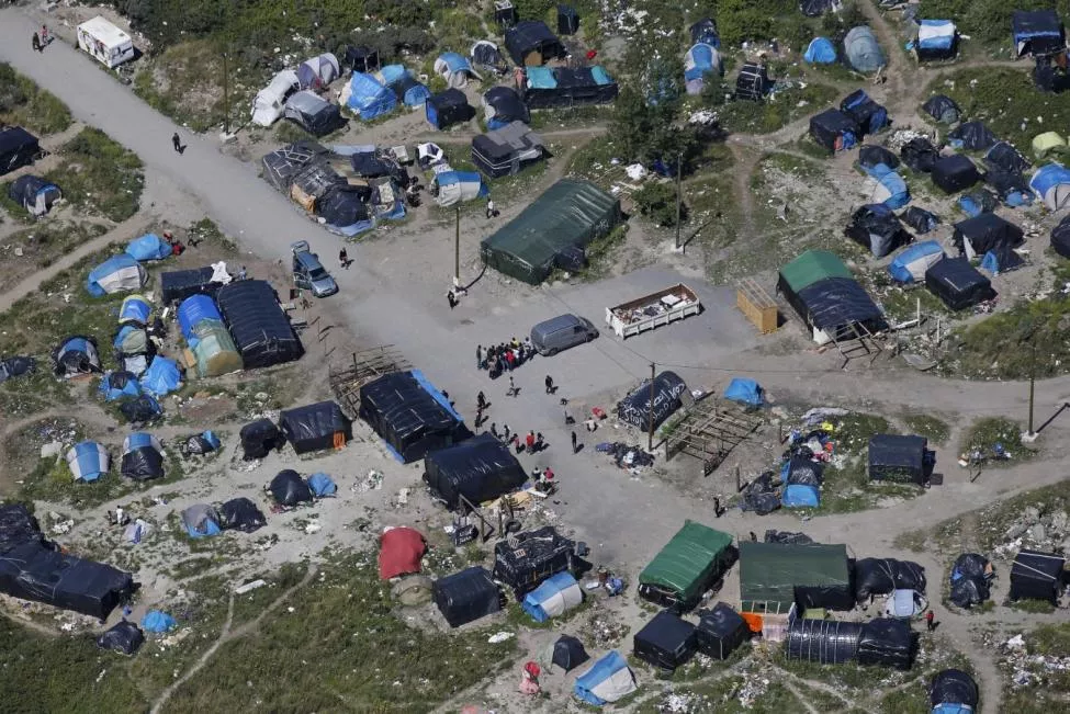 an aerial view shows a field named quot the new jungle quot with tents and makeshift shelters where migrants and asylum seekers stay in calais photo reuters an aerial view shows a field named quot the new jungle quot with tents and makeshift shelters where migrants and asylum seekers stay in calais photo reuters