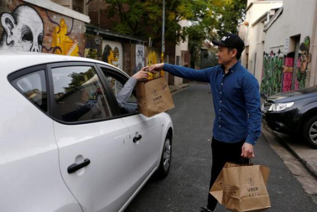 an uber driver takes delivery of bags photo reuters