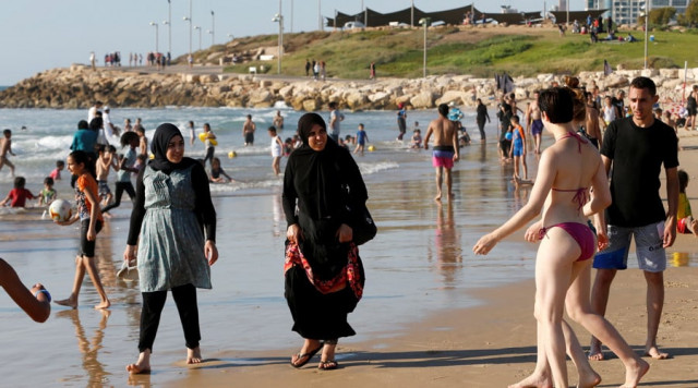 the group of 12 seven of whom were wearing hijabs visited the town for the first time last week and say they will not be returning photo reuters the group of 12 seven of whom were wearing hijabs visited the town for the first time last week and say they will not be returning photo reuters