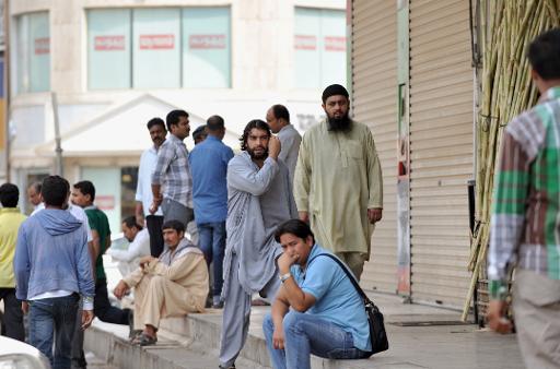 file picture shows foreign workers gathering near the saudi immigration ministry in riyadh on november 4 2013 photo afp