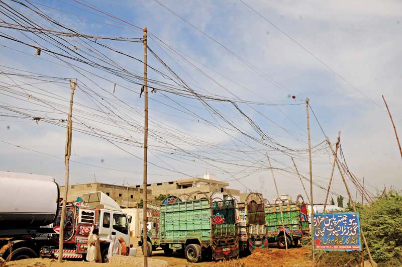 korangi industrial area residents use illegal electricity connections locally known as kundas photo file