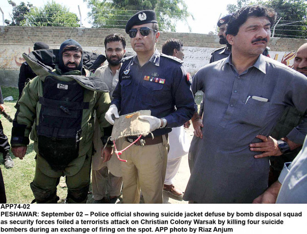 police official showing a suicide jacket defuse by bomb disposal squad as security forces foiled a terrorists attack on christian colony warsak photo afpp police official showing a suicide jacket defuse by bomb disposal squad as security forces foiled a terrorists attack on christian colony warsak photo afpp
