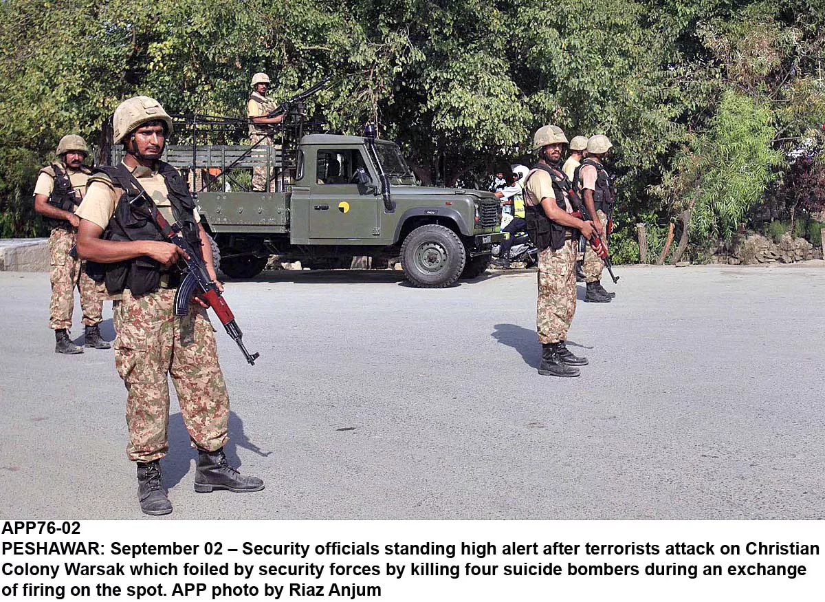 security officials standing high alert after terrorists attack on christian colony warsak photo afpp security officials standing high alert after terrorists attack on christian colony warsak photo afpp