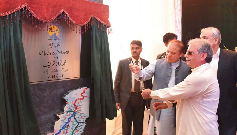 pm nawaz unveils the plaque at the ground breaking of lahore eastern bypass photo inp