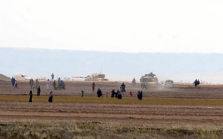 syrian civilians with turkish army tanks in the background walk through the turkish border as they are pictured from a village in kilis province turkey september 3 2016 photo reuters syrian civilians with turkish army tanks in the background walk through the turkish border as they are pictured from a village in kilis province turkey september 3 2016 photo reuters