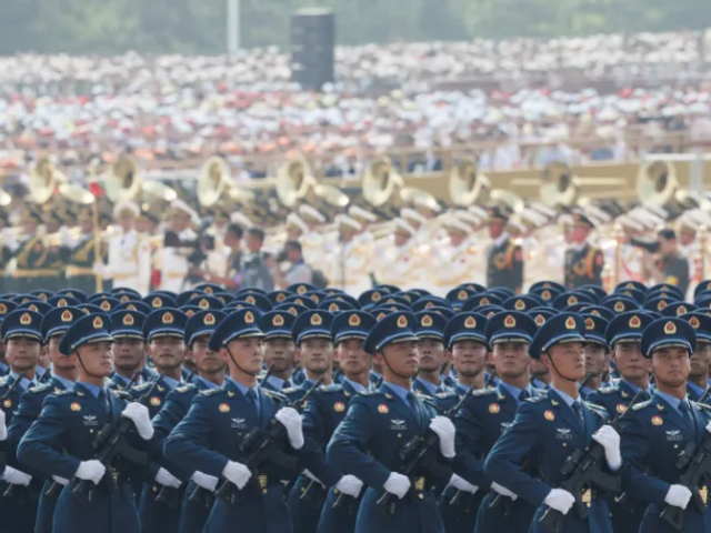 Members of the PLA Air Force march during a military parade [Reuters]
