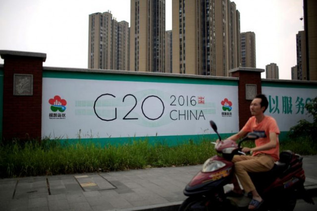 a man rides an electronic bike past a billboard for the upcoming g20 summit in hangzhou zhejiang province china july 29 2016 photo reuters a man rides an electronic bike past a billboard for the upcoming g20 summit in hangzhou zhejiang province china july 29 2016 photo reuters