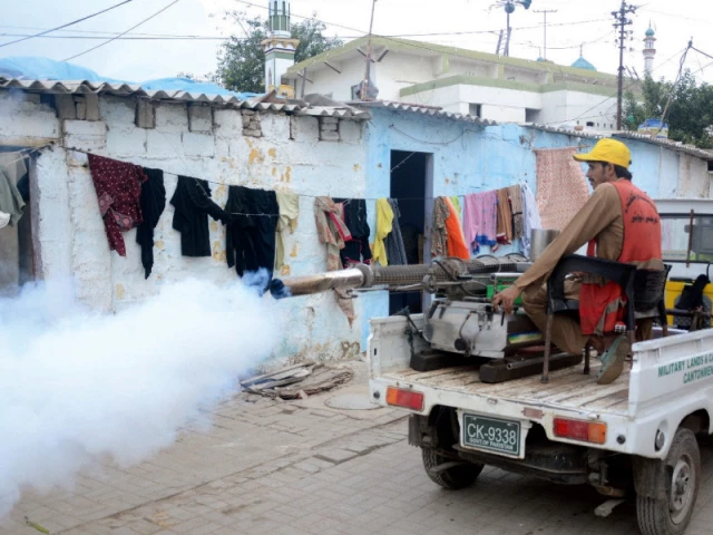 in the quiet corridors of tooba apartments railway colony and surrounding neighbourhoods cbc staff move with purpose misting the air with insecticide   a gentle shield against unseen wings that carry illness photo jalal qureshi express