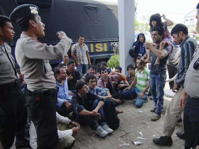 in this file photo asylum seekers from afghanistan and pakistan argue with indonesian policemen at a temporary shelter in merak indonesia 039 s banten province september 27 2013 photo reuters file in this file photo asylum seekers from afghanistan and pakistan argue with indonesian policemen at a temporary shelter in merak indonesia 039 s banten province september 27 2013 photo reuters file
