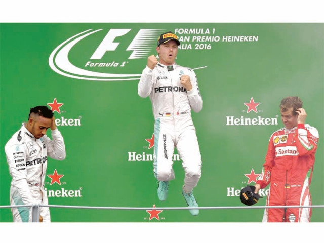 rosberg jumps for joy on the podium after winning the italian grand prix yesterday photo afp