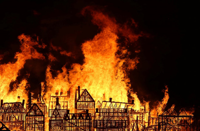 a 120 meter long model of the 17th century london skyline is set alight on the river thames to commemorate the 1666 great fire of london in london britain photo reuters