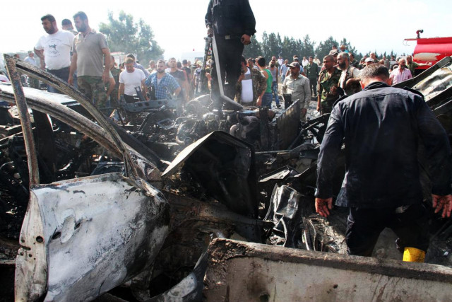 a handout picture released by the official syrian arab news agency sana on september 5 2016 reportedly shows syrians and security forces gathering at the site of a blast targeting the arzuna bridge in a government held area outside the syrian city of tartus photo afp a handout picture released by the official syrian arab news agency sana on september 5 2016 reportedly shows syrians and security forces gathering at the site of a blast targeting the arzuna bridge in a government held area outside the syrian city of tartus photo afp